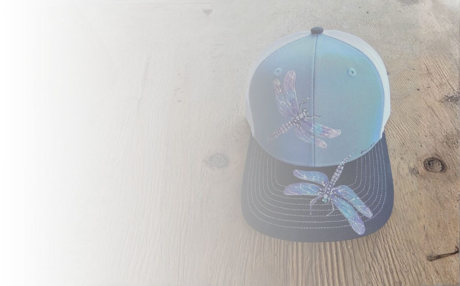 Hand-painted dragonfly art hat created by Maui artist Therese Tice.