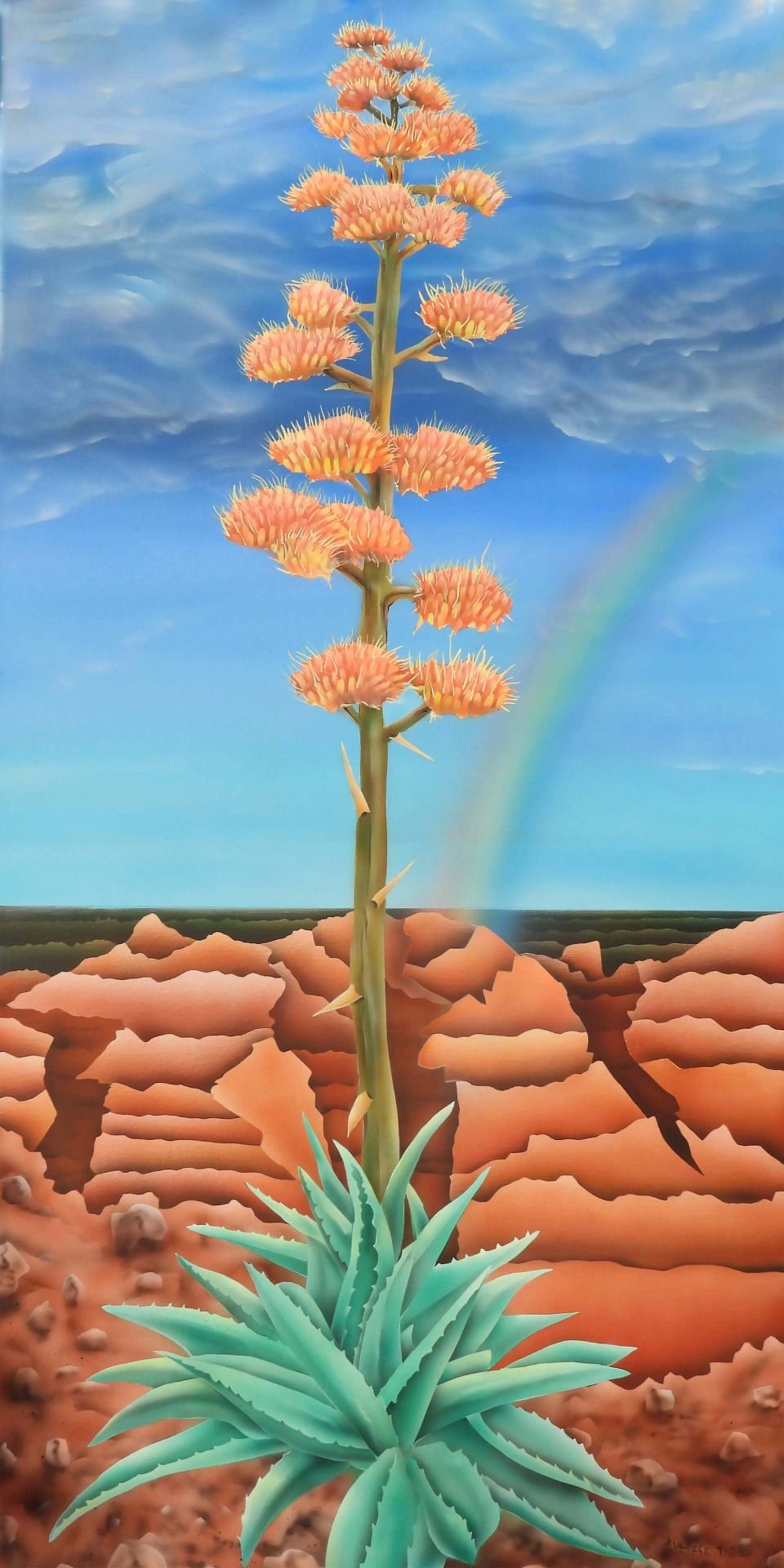 Blooming agave plant rising from desert landscape with orange flowers, blue sky, and a faint rainbow